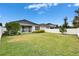Large grassy backyard with a privacy fence at 7102 Wesley Palm Way, Wesley Chapel, FL 33545