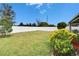 Large fenced backyard with grassy lawn at 7102 Wesley Palm Way, Wesley Chapel, FL 33545