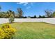 Large fenced backyard with green grass at 7102 Wesley Palm Way, Wesley Chapel, FL 33545