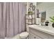Simple bathroom with shower/tub combo and updated vanity at 7102 Wesley Palm Way, Wesley Chapel, FL 33545