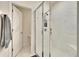 Clean bathroom with a large walk-in shower and tiled walls at 7102 Wesley Palm Way, Wesley Chapel, FL 33545