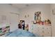 bedroom with twin bed, dresser, and playful decor at 7102 Wesley Palm Way, Wesley Chapel, FL 33545