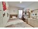 Cozy bedroom with built-in desk and window at 7102 Wesley Palm Way, Wesley Chapel, FL 33545