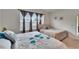 Bright bedroom featuring two beds and plenty of natural light at 7102 Wesley Palm Way, Wesley Chapel, FL 33545