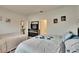 Well-lit bedroom with two beds and dresser, plus access to bathroom at 7102 Wesley Palm Way, Wesley Chapel, FL 33545