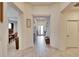 Bright and airy entryway with tile floors, leading to living areas at 7102 Wesley Palm Way, Wesley Chapel, FL 33545