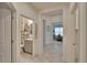 Bright hallway with laundry and dining area views at 7102 Wesley Palm Way, Wesley Chapel, FL 33545