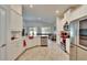 Modern kitchen with white cabinets and granite countertops at 7102 Wesley Palm Way, Wesley Chapel, FL 33545