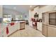 Modern kitchen with white cabinets and granite countertops at 7102 Wesley Palm Way, Wesley Chapel, FL 33545
