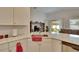 Kitchen features a corner sink and granite countertops at 7102 Wesley Palm Way, Wesley Chapel, FL 33545