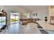 Open living space with sectional sofa and view of backyard at 7102 Wesley Palm Way, Wesley Chapel, FL 33545