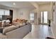 Spacious living area with gray couches and view of entryway at 7102 Wesley Palm Way, Wesley Chapel, FL 33545