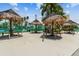 Relax under the tiki huts near the tennis courts at 7300 Sun Island S Dr # 203, South Pasadena, FL 33707