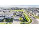 Aerial view of a house and surrounding community at 7678 Notched Pine Bnd, Wesley Chapel, FL 33545