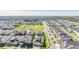Aerial view of community with a park and playground at 7678 Notched Pine Bnd, Wesley Chapel, FL 33545