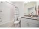 Clean bathroom with a shower/tub combo and granite countertop at 7678 Notched Pine Bnd, Wesley Chapel, FL 33545