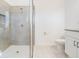 Clean bathroom with walk-in shower and white vanity at 7678 Notched Pine Bnd, Wesley Chapel, FL 33545
