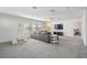 Spacious bonus room with a sectional sofa and teepee at 7678 Notched Pine Bnd, Wesley Chapel, FL 33545
