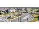 Gated entrance to the community with landscaping and signage at 7678 Notched Pine Bnd, Wesley Chapel, FL 33545