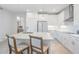 Modern kitchen with stainless steel appliances and white cabinets at 7678 Notched Pine Bnd, Wesley Chapel, FL 33545