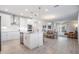 Open concept kitchen with island and stainless steel appliances at 7678 Notched Pine Bnd, Wesley Chapel, FL 33545