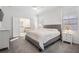 Spacious main bedroom with ensuite bathroom and ample closet space at 7678 Notched Pine Bnd, Wesley Chapel, FL 33545