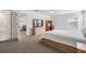 Main bedroom with attached bath and large TV at 7678 Notched Pine Bnd, Wesley Chapel, FL 33545