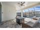 Relaxing screened-in pool area with patio furniture and fire pit at 7678 Notched Pine Bnd, Wesley Chapel, FL 33545