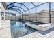 Stunning pool and spa with a screened enclosure at 7678 Notched Pine Bnd, Wesley Chapel, FL 33545