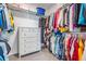 Large walk-in closet with ample shelving and hanging space at 7678 Notched Pine Bnd, Wesley Chapel, FL 33545