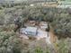 Aerial view of house, detached garage, and landscaping at 8575 Carey Rd, Lithia, FL 33547