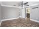 Bright bedroom with hardwood floors and an ensuite bathroom at 8575 Carey Rd, Lithia, FL 33547