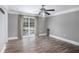 Bedroom with hardwood floors, large window, and backyard view at 8575 Carey Rd, Lithia, FL 33547