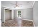Well-lit bedroom with hardwood floors and walk-in closet at 8575 Carey Rd, Lithia, FL 33547
