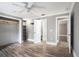 Hardwood floor bedroom with a large window and closet at 8575 Carey Rd, Lithia, FL 33547