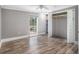 Bedroom with hardwood floors, a large window and closet at 8575 Carey Rd, Lithia, FL 33547