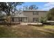 House exterior showcasing a stone patio at 8575 Carey Rd, Lithia, FL 33547