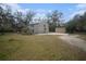 Two-story house with detached garage and yard at 8575 Carey Rd, Lithia, FL 33547