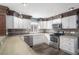 Modern kitchen featuring wood and white cabinets at 8575 Carey Rd, Lithia, FL 33547