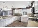 Spacious kitchen with white cabinets and stainless steel appliances at 8575 Carey Rd, Lithia, FL 33547