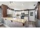 L-shaped kitchen with an island and stainless steel appliances at 8575 Carey Rd, Lithia, FL 33547