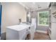 Laundry room with washer, dryer, and storage shelving at 8575 Carey Rd, Lithia, FL 33547