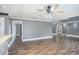 Spacious living room featuring hardwood floors and a ceiling fan at 8575 Carey Rd, Lithia, FL 33547