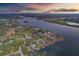 Wide aerial showcasing waterfront homes and community at 8839 W Millpoint Rd, Riverview, FL 33578