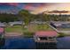 Stunning aerial view of waterfront home with private dock and boat lift at 8839 W Millpoint Rd, Riverview, FL 33578