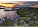 Wide aerial view of waterfront home and neighborhood at 8839 W Millpoint Rd, Riverview, FL 33578