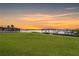Spacious backyard with a lush lawn and waterfront access at 8839 W Millpoint Rd, Riverview, FL 33578