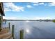Wooden dock extending over calm water with distant view at 8839 W Millpoint Rd, Riverview, FL 33578