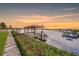 Private waterfront dock with covered boat lift at 8839 W Millpoint Rd, Riverview, FL 33578