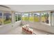 Bright sunroom with large windows and water view at 8839 W Millpoint Rd, Riverview, FL 33578